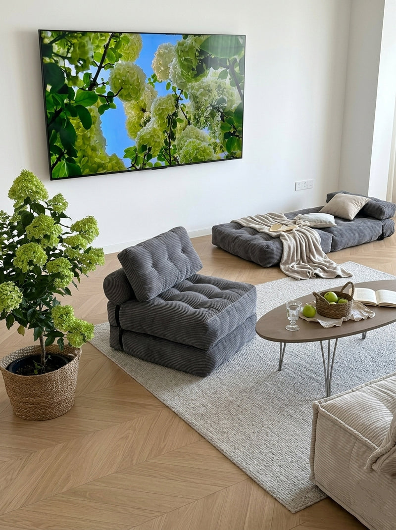 Tofu Block chair and flattened bed in a bright room