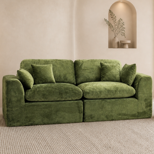 Moss green ROREN Cloud 2-seater sofa in a warm apartment